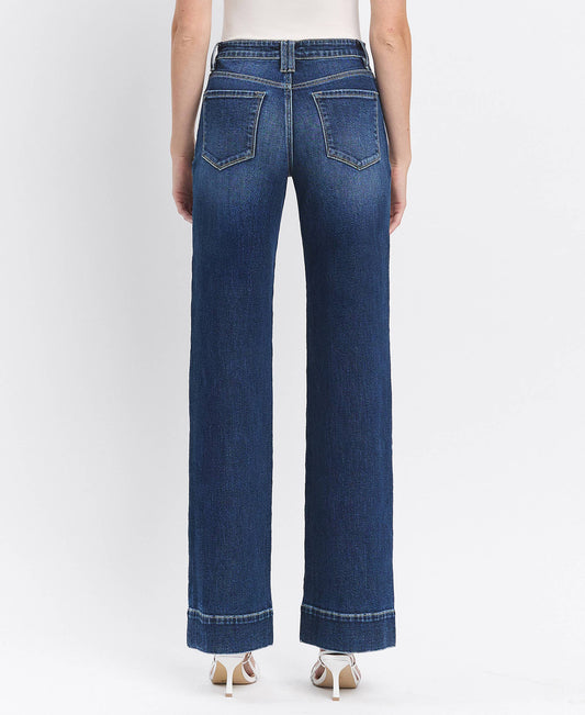 Blue jeans worn by a person on a white background