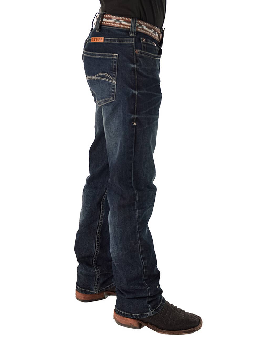 Person wearing dark blue jeans on a white background