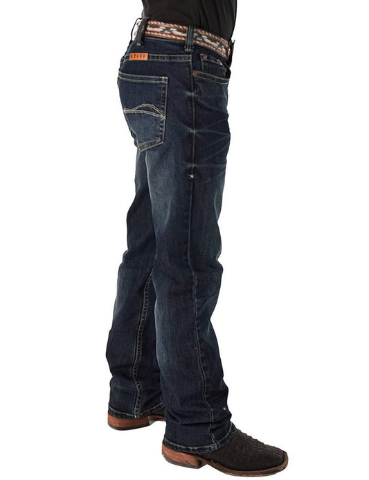 Person wearing dark blue jeans on a white background