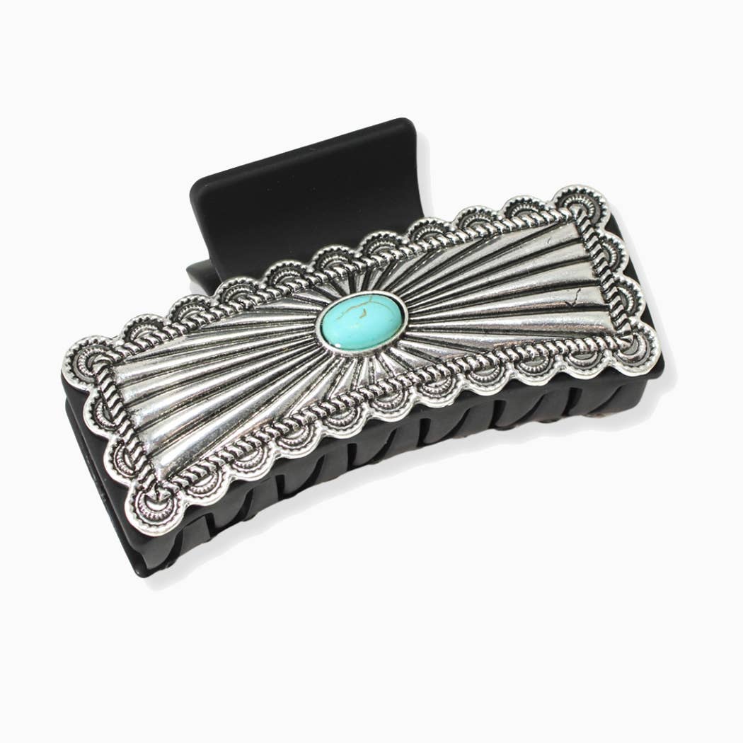 Silver hair clip with turquoise stone on a white background