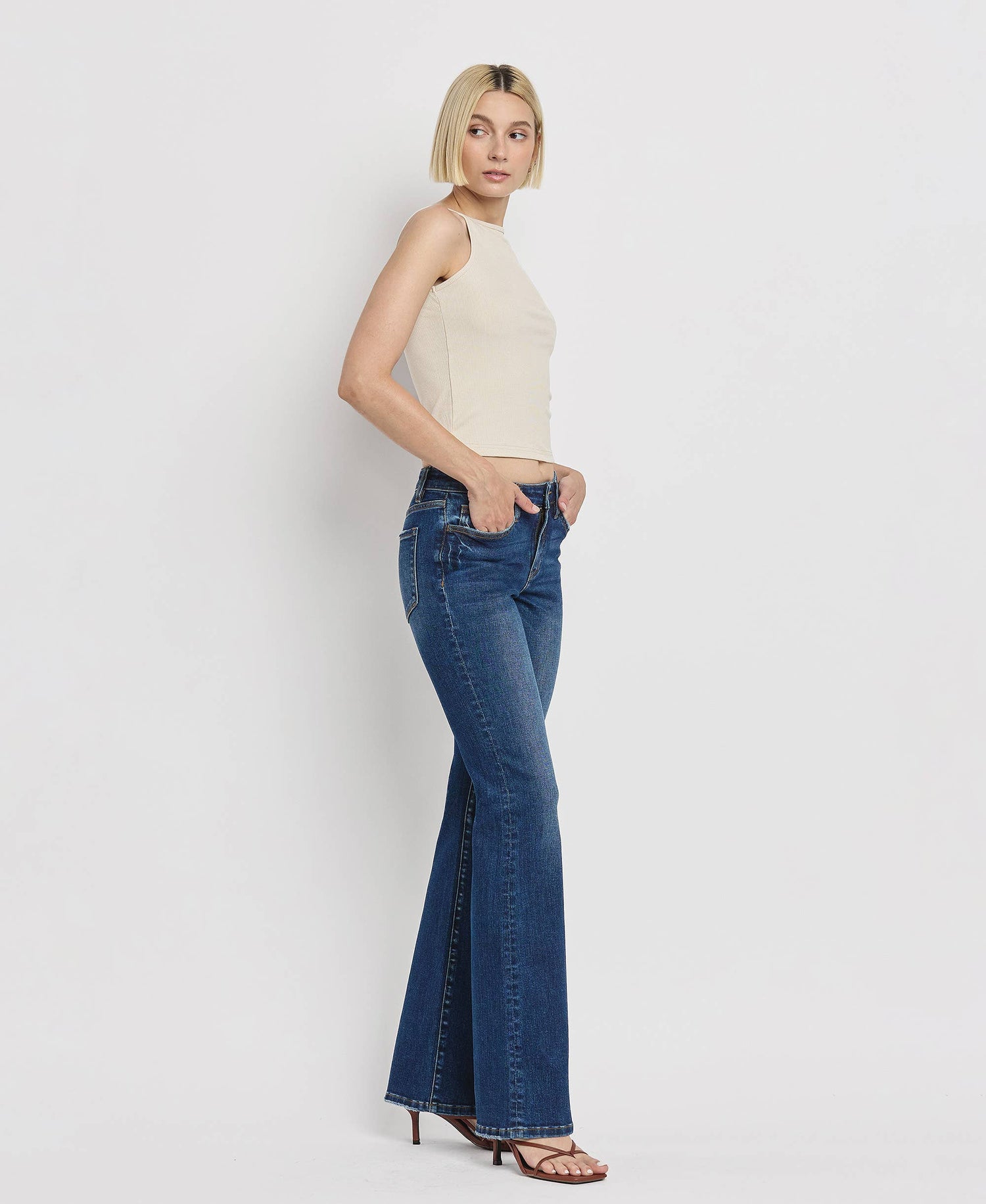 Mid-Rise Relaxed Bootcut Jeans come with comfort stretch denim and finished hem.