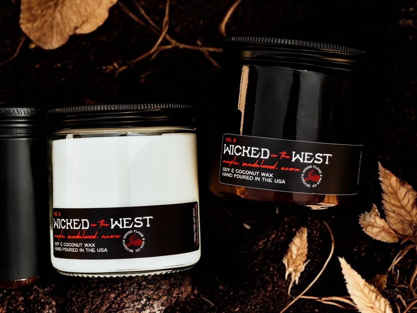 Three candles with 'Wicked in the West' branding on a dark background with leaves.