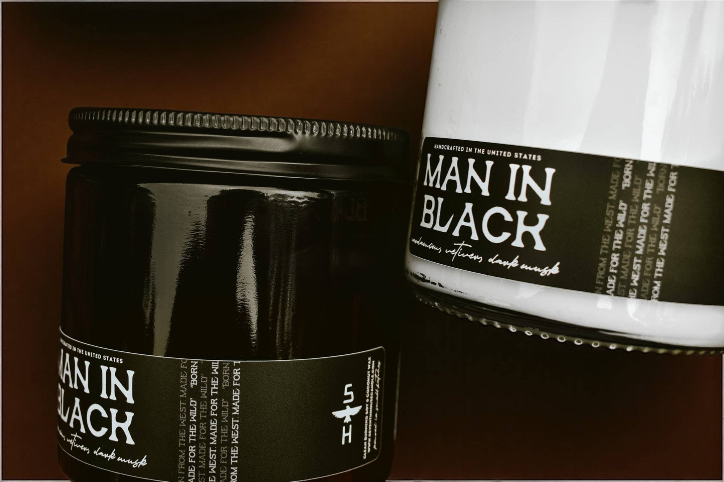 Two 'Man in Black' products on a dark background