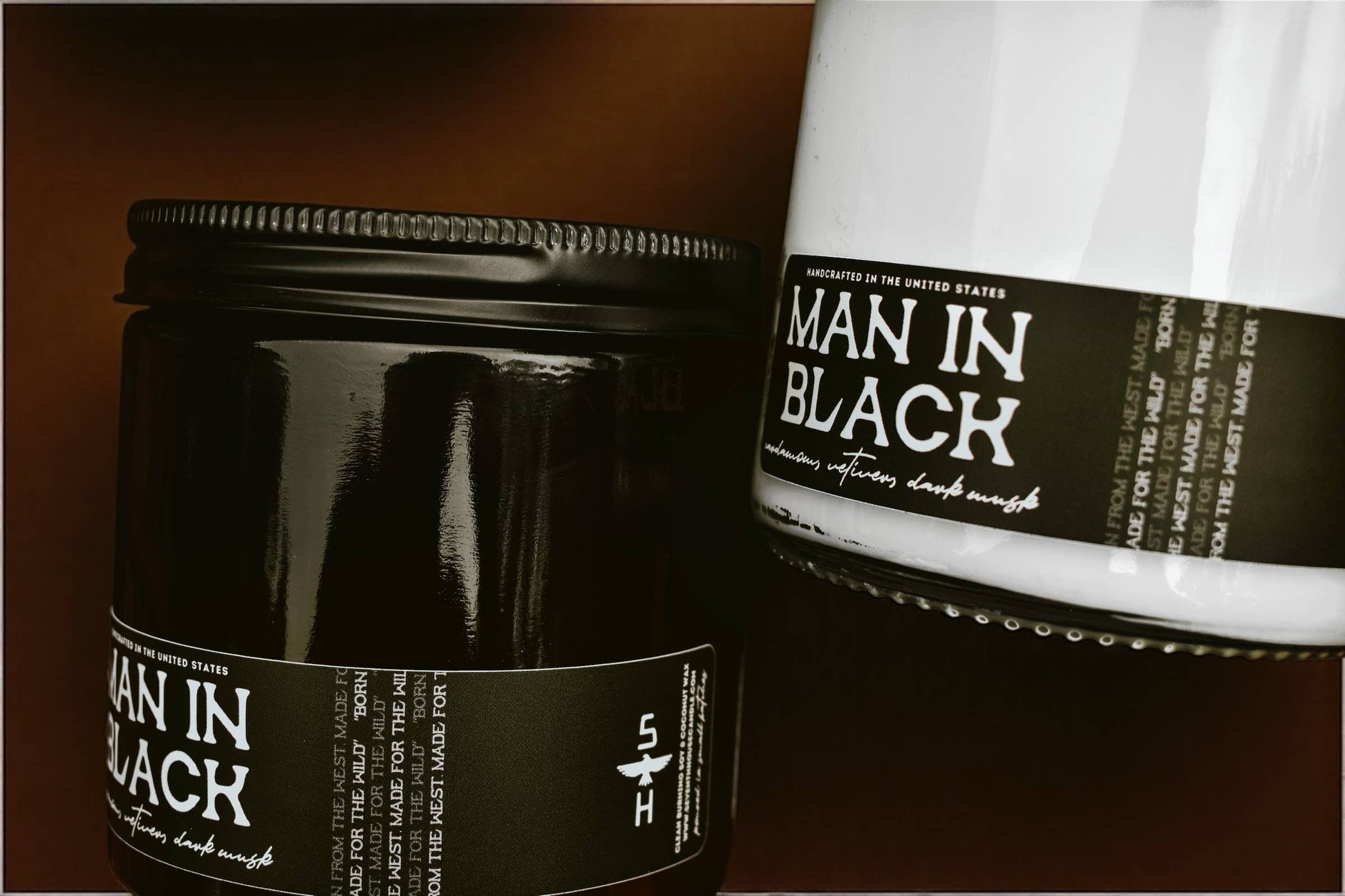 Two 'Man in Black' products on a dark background