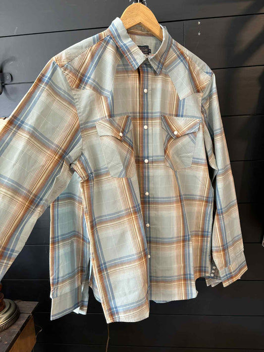 Plaid shirt on a hanger against a dark background