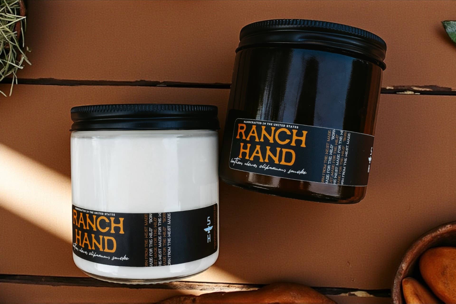 Two 'Ranch Hand' containers on a wooden surface
